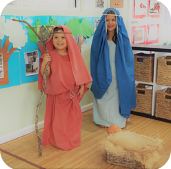 Children dressed as shepherds acting out a skit